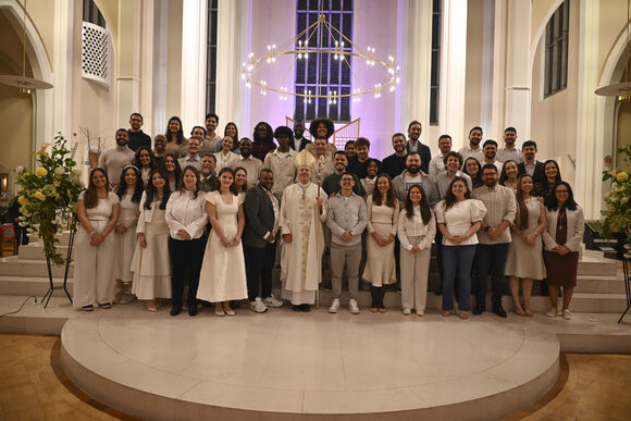 The 25 adults with their sponsors who received Sacraments of Initiation at the Easter Vigil in the Cathedral
