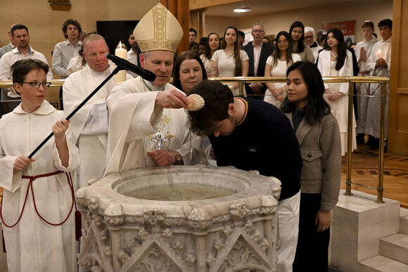 Dudley O’Grady-Woods being baptised at the Easter Vigil