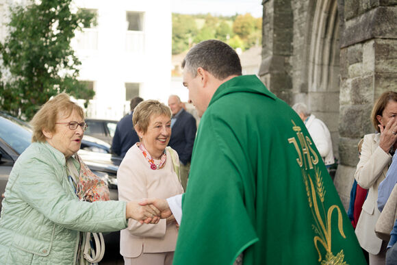 Fr. Marius meets parishioners after Mass