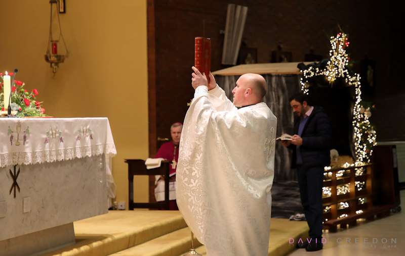 Father Roman Biletskyy saying mass at a special Ukrainian service on Christmas Eve
