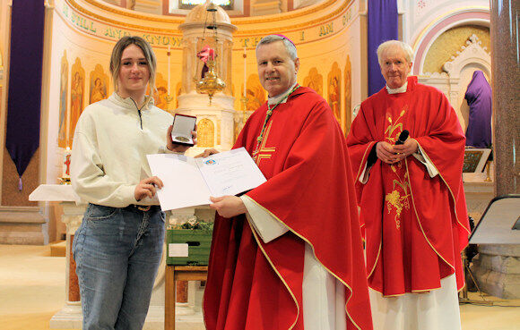 Ciara Dennehy accepts her award from Bishop Fintan