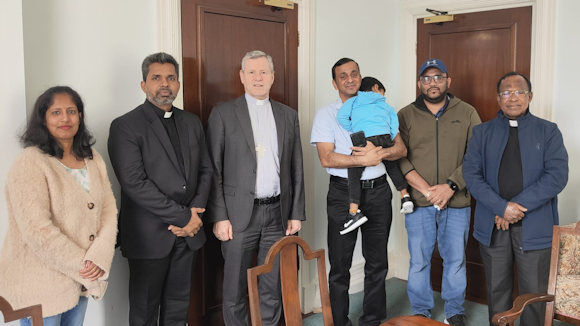 Fr. Shinu Varghese (second left), Fr. Cherian Thazhamon (on the right from Dublin) with members of the Syro Malankara Community, Sini, Shijin and Anish being welcomed by Bishop Fintan