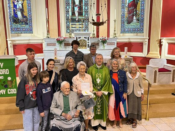 Bishop Fintan with Patricia Kelleher and her husband Pat and family members in St. Columba’s Church