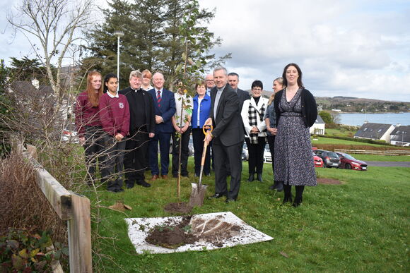 Accompanied by school Principal Ms. Sarah Buckley, Bishop Fintan plants a tree to mark the occasion of his Pastoral Visit in recognition of the 40th Anniversary of the foundation of Schull Community College.