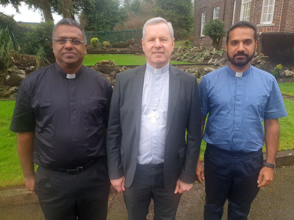 Fr. Jaison Mathew (L) and Fr. Biju Ilanjikkal Devasia (R) with Bishop Fintan