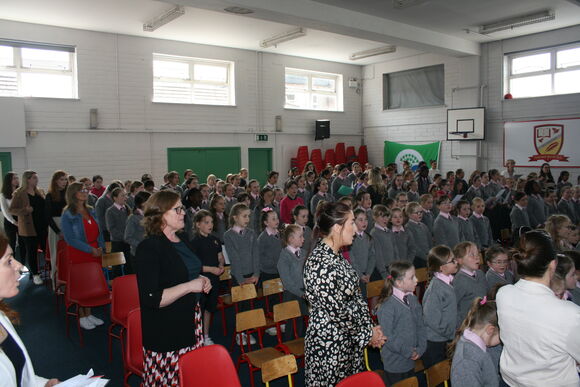 Pupils of Scoil an Athar Maitiú GNS pray with Bishop Fintan