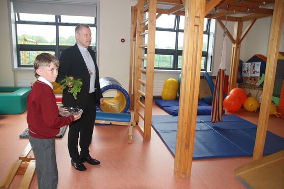 One of the new classrooms is blessed in Scoil an Athar Tadhg Carrignavar