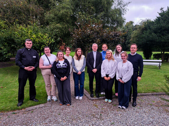 Volunteer nurses meet with organisers of the pilgrimage