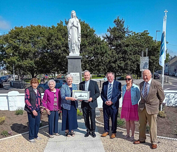 Bishop Fintan Gavin making a presentation to Redempta Furney, president of the Cashel province of the Society.