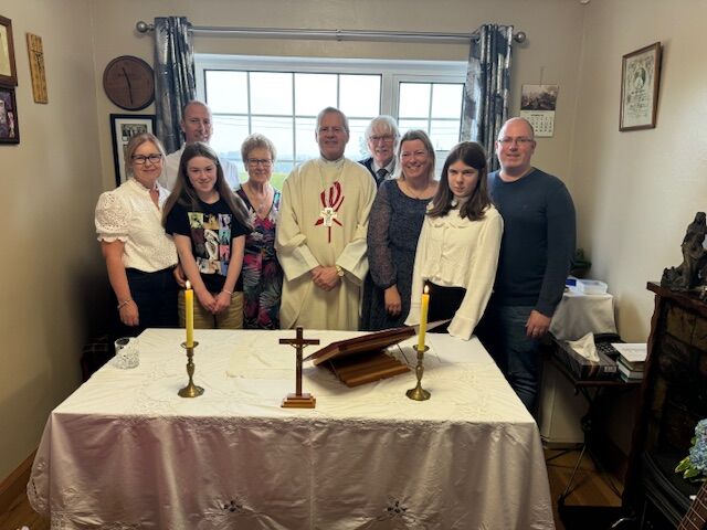 Mossie Breda Buckley with their family and Bishop Fintan