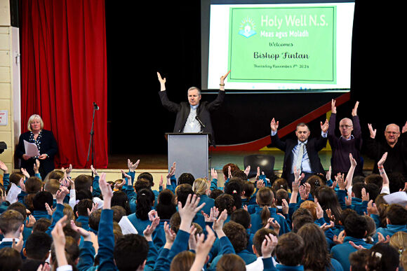 Bishop Fintan leads the prayer at the school.