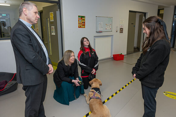 Bishop Fintan visited the ASD Unit, where he was introduced to the school therapy dog Alma.