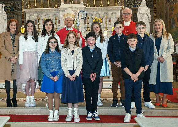 Bishop of Cork and Ross Fintan Gavin pictured in the Church of the Nativity of the Blessed Virgin Mary, Timoleague with Confirmation candidates from Clogagh National School.  Also included are Canon John Kingston, Co-PP, Kathleen Calnan SNA and Helen O'Flynn, principal.  Photo: Martin Walsh.