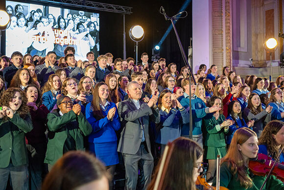 Bishop Fintan on stage at Cork City Hall with the Maranatha choir