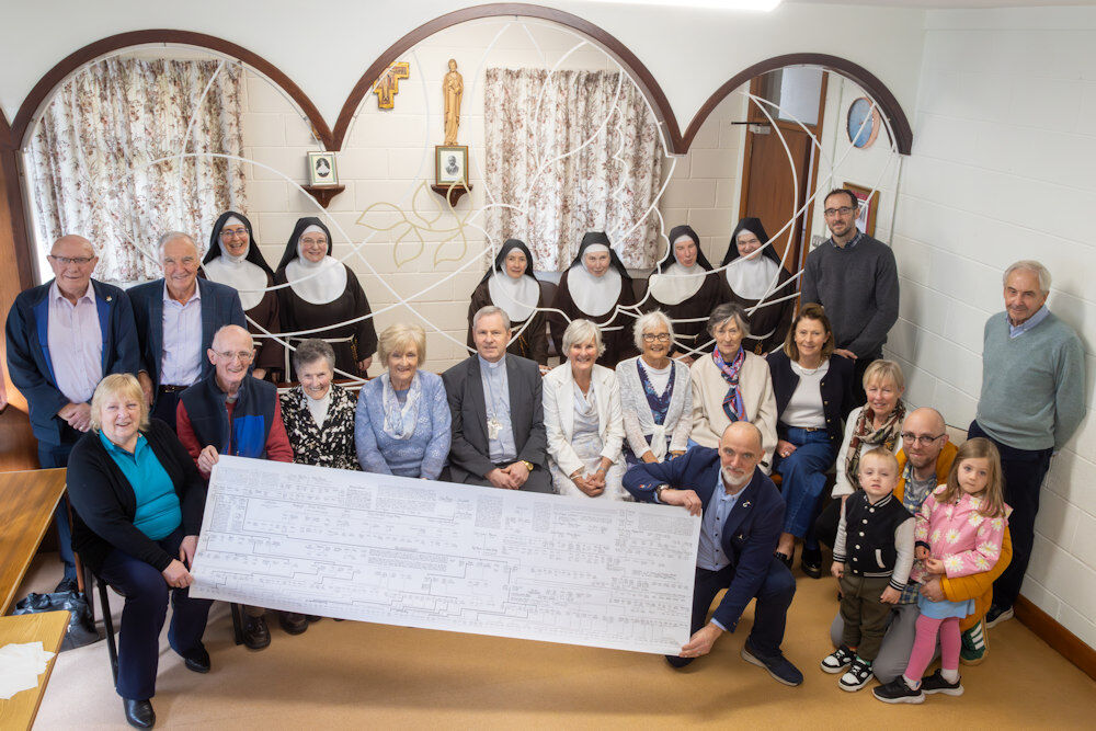 Descendants of Walter Dwyer and relatives of Sr. Maria with hand-scripted scroll of the Dwyer family tree Descendants of Walter Dwyer and relatives of Sr. Maria with hand-scripted scroll of the Dwyer family tree