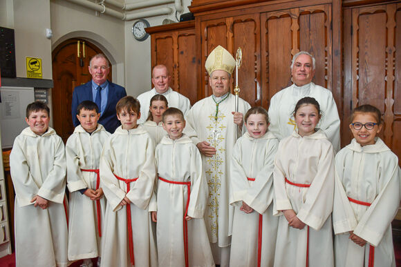 Bishop Fintan Gavin with Fr. Kevin O'Regan, Fr. Evin O'Brien, Bernie Kelly and the altar servers before the special Mass to celebrate the Bicentenary of St. Patrick's Cathedral in Skibbereen. Photo; Anne Minihane.