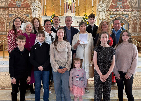 Maura Whelton pictured with her extended family in the Church of Our Lady, Star of the Sea, Barryroe. Photo: Paul Finn.