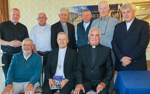 Bishop Fintan with current priests and those who previously served the parish.