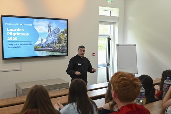 Fr. Marius O'Reilly spoke to the school helpers about the story of Lourdes and St. Bernadette