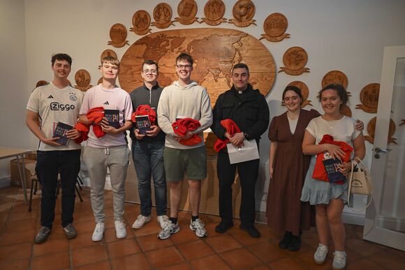 Stephen Berard, John Lehane, Conor Singleton, Cillian Ó'Cróinín, Fr Marius O'Reilly, Aoibh Kingston and Alannah Hegarty after being presented with their bibles and t-shirts.