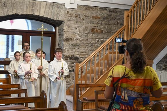 Olivia Walsh filming the altar servers in Kilbrittain Parish. DSC 6105